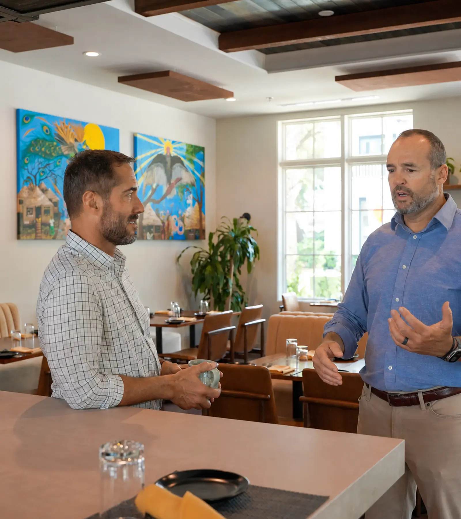 Matt Cunningham and Scott Songer discussing small-business decisions at The Bridge Collective