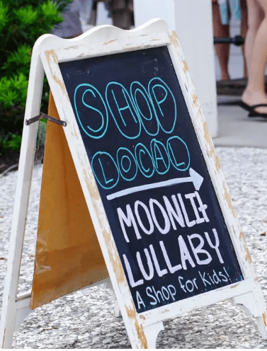 A Shop Local sign outside a small business